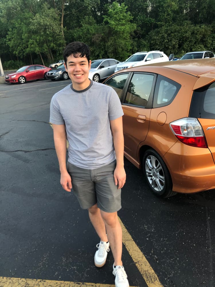 Dennis Cope in front of his glorious Honda Fit